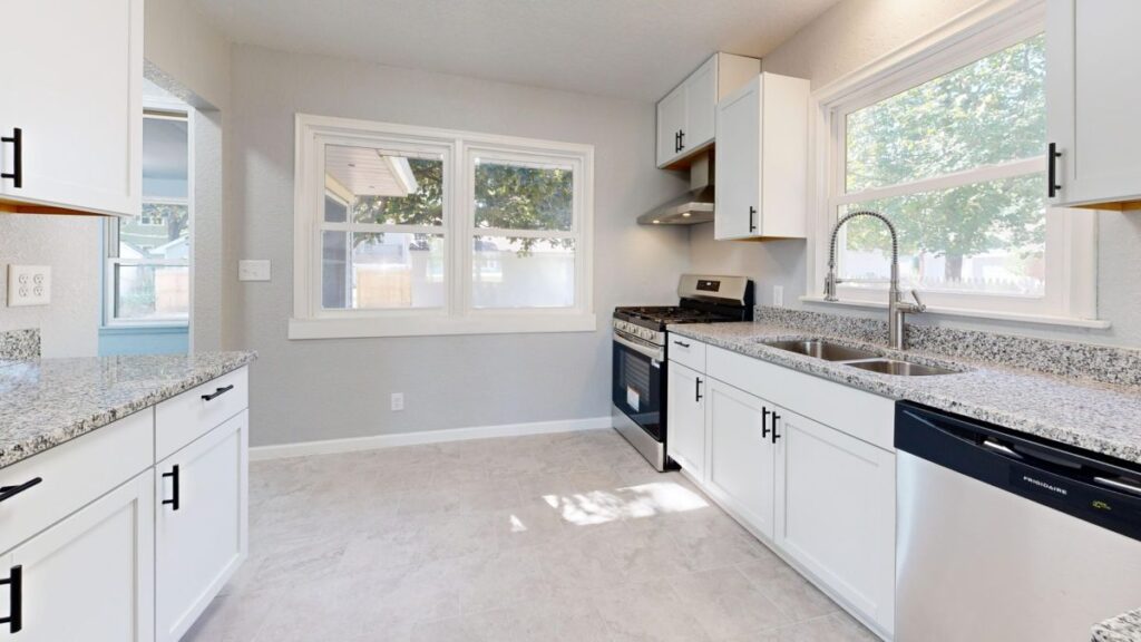 Bright modern kitchen remodel featuring warm wood cabinets and quartz countertops in Arlington TX