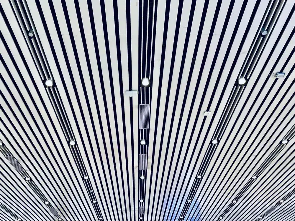 Suspended ceiling grid with recessed LED lighting in a finished commercial office space