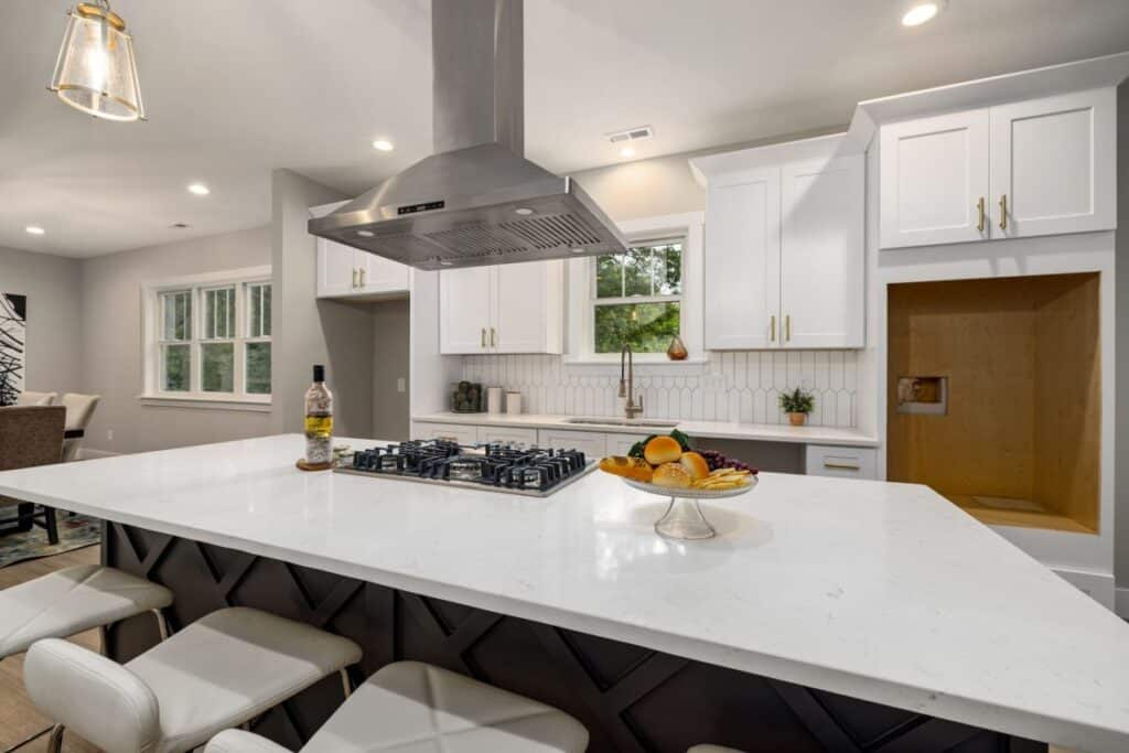 Bright modern kitchen remodel with white cabinets and quartz countertops in Hurst TX home