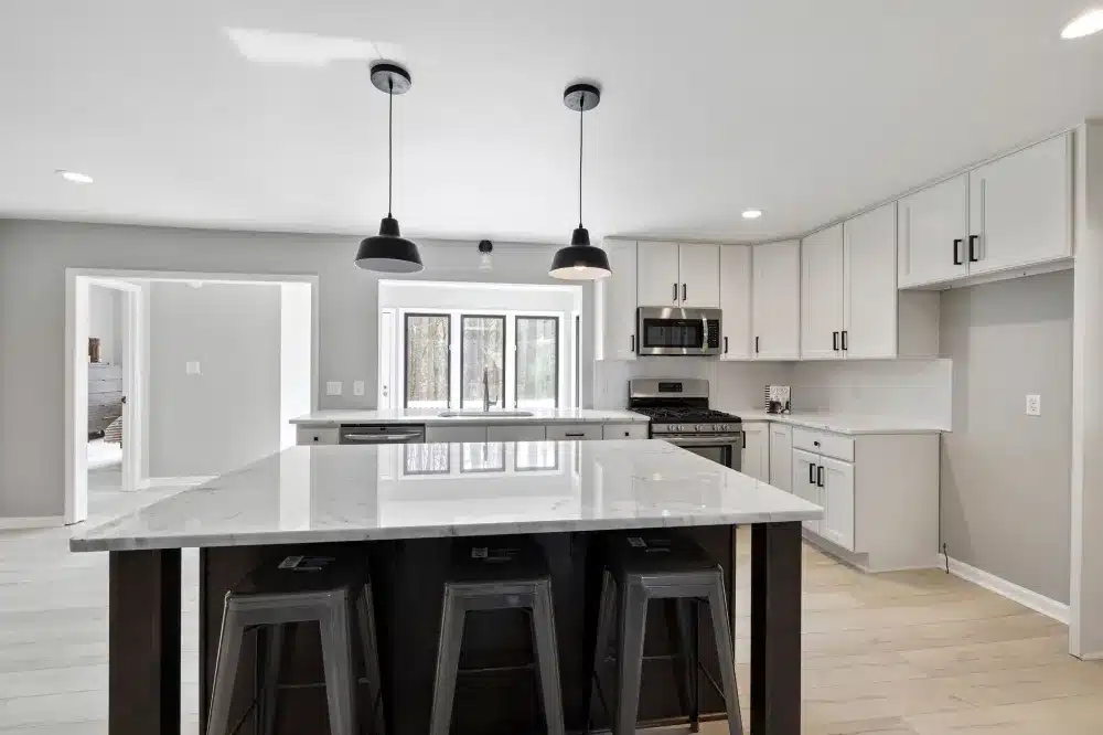 Finished open-concept kitchen renovation with new island and pendant lighting in Hurst TX