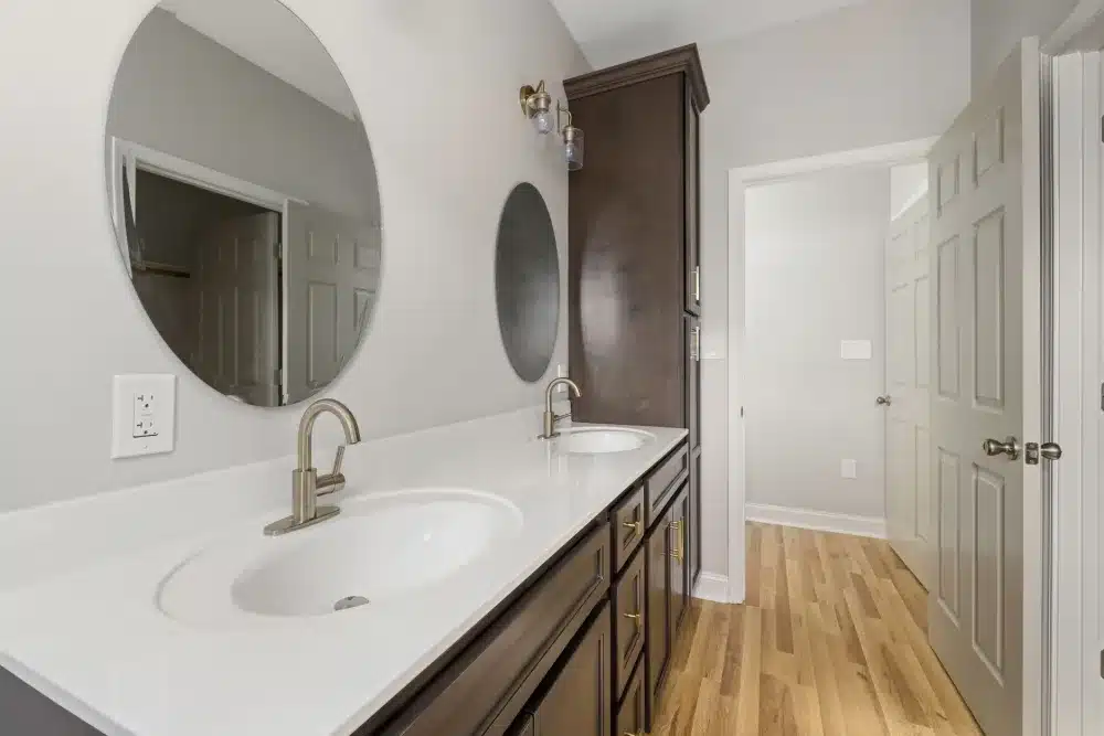 New double vanity with quartz countertops in a renovated Hurst Texas master bathroom