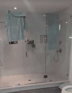 shower with glass frameless doors