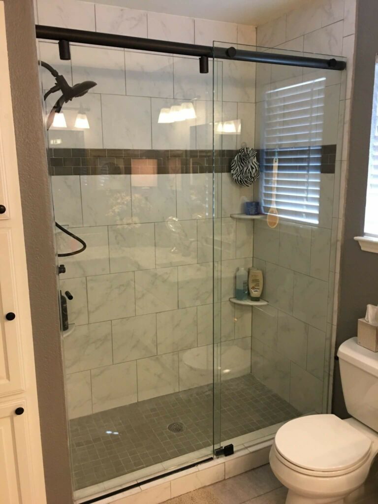 shower with sliding glass doors