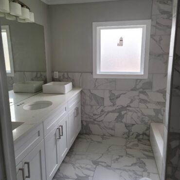 white marble tile in bathroom remodel