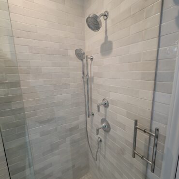 stand up shower with glass door silver fixtures