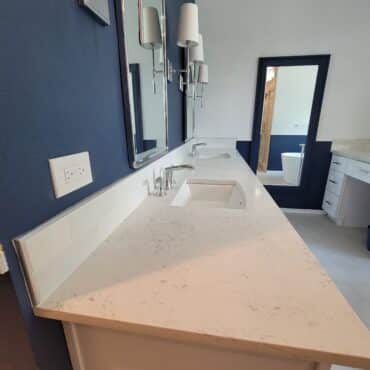 angled view of dual sink in bathroom remodel