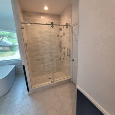 stand up shower with frameless glass doors