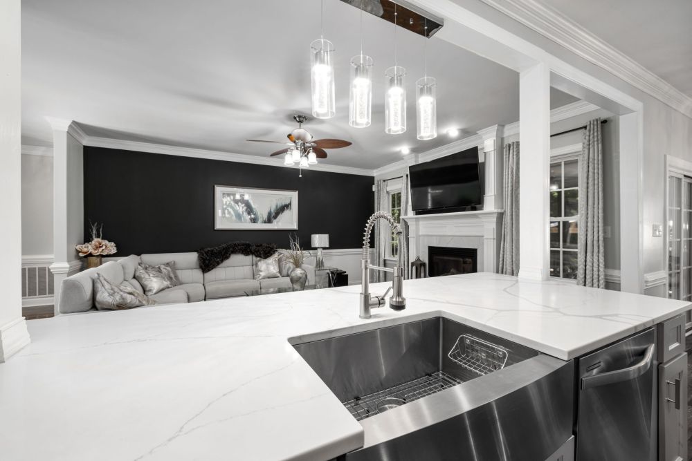 Freshly installed quartz countertops on kitchen perimeter during a Dallas-Fort Worth home renovation