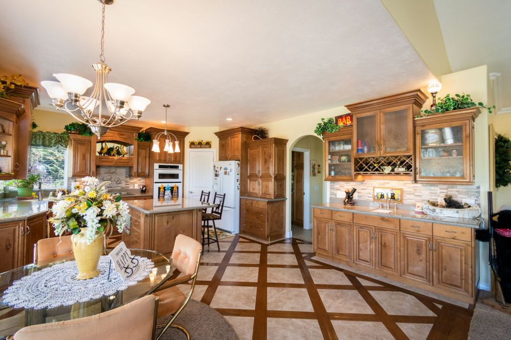 Warm-toned wood kitchen cabinets replacing dated white laminate in a DFW home remodel