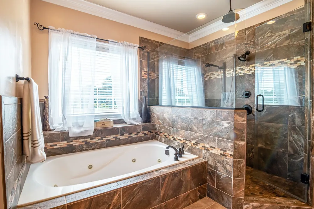Walk-in shower with large format tile during bathroom remodel in Arlington TX