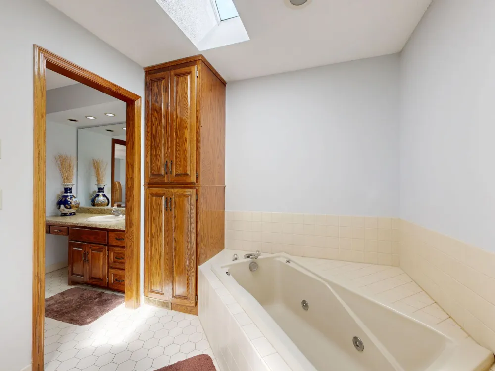 Outdated bathroom with old tile and brass fixtures ready for a remodel in Arlington TX