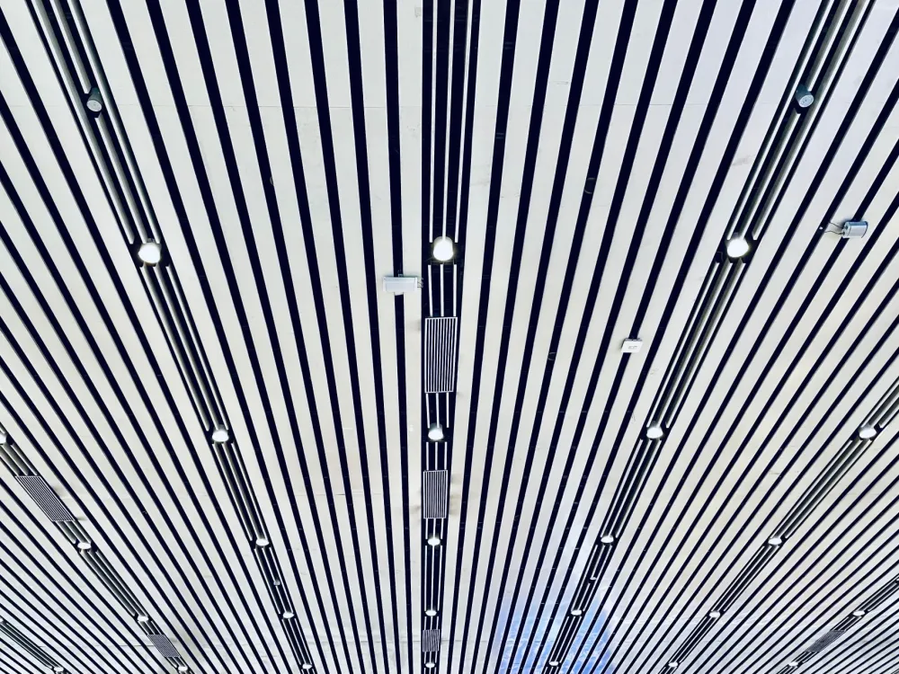 Suspended ceiling grid with recessed LED lighting in a finished commercial office space
