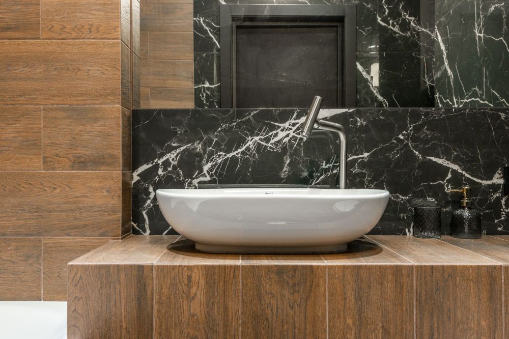 Completed modern bathroom remodel with frameless glass shower and updated fixtures