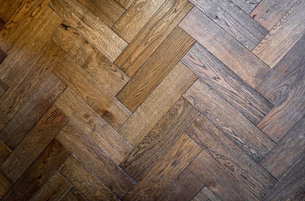 Contractor installing luxury vinyl plank flooring in a mid-cities Texas home remodel