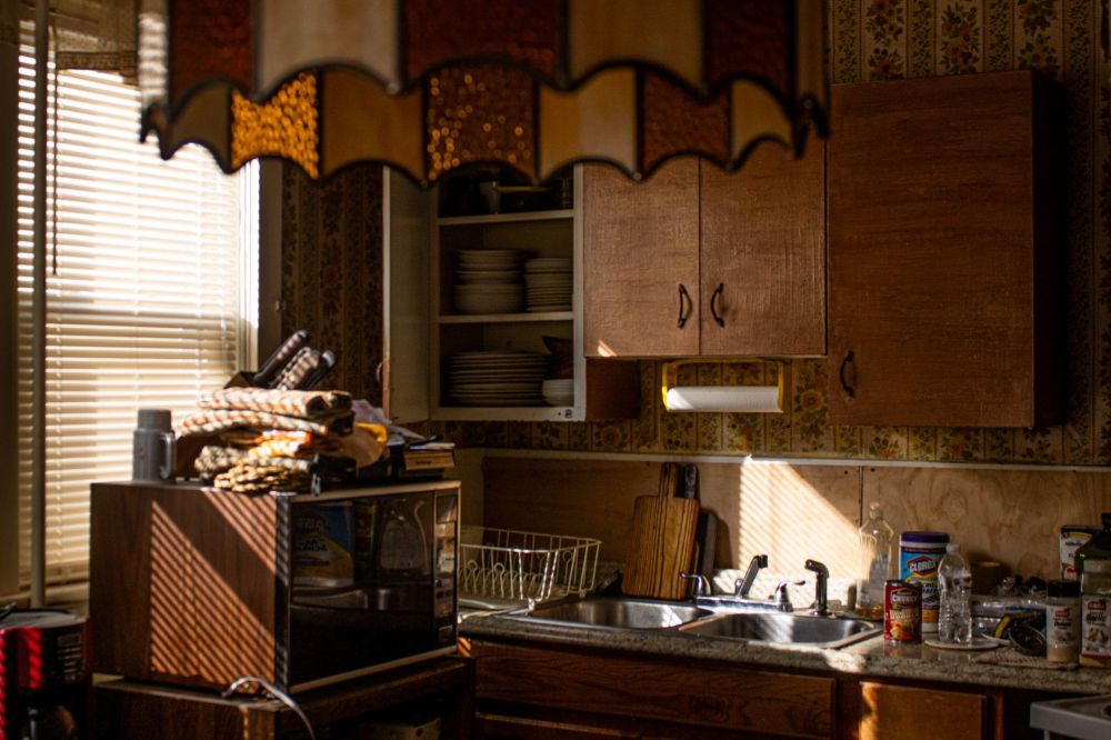 Warm wood tone kitchen cabinets with integrated hardware in a 2026 remodel