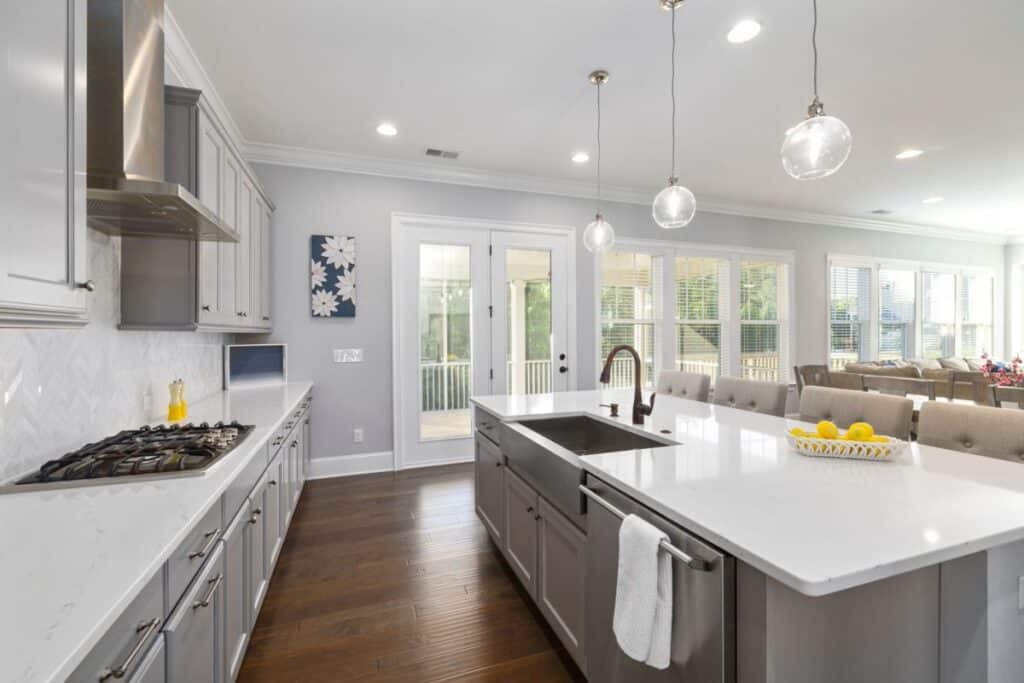 Bright modern kitchen remodel with white cabinetry and quartz countertops in Bedford TX home