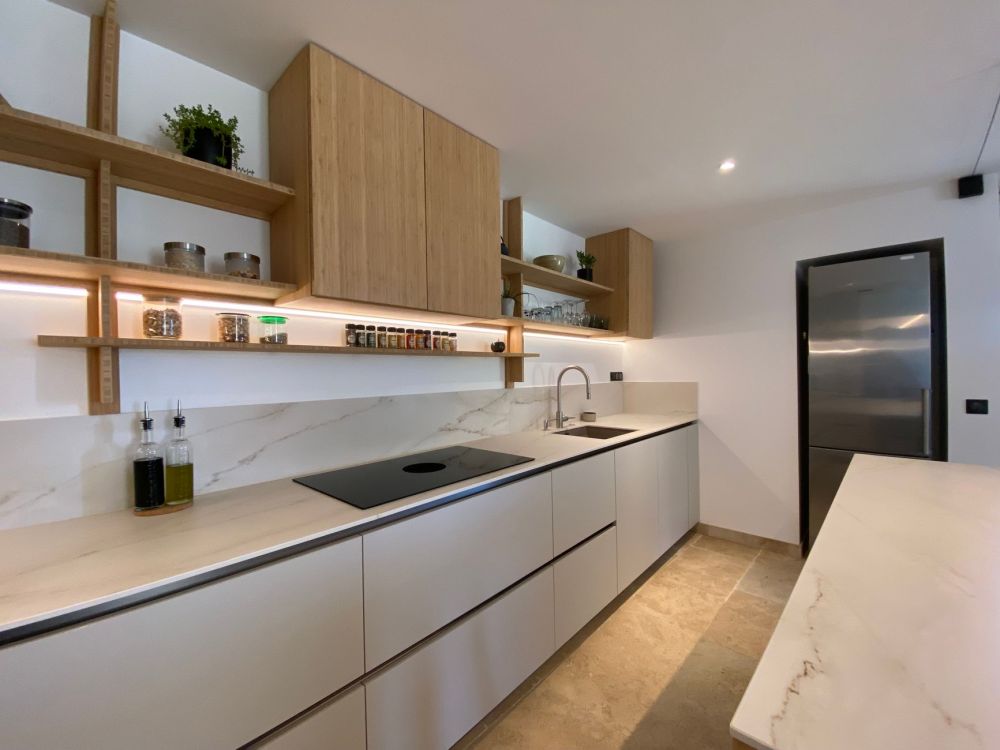 Open kitchen shelving showing cluttered dishes instead of curated display