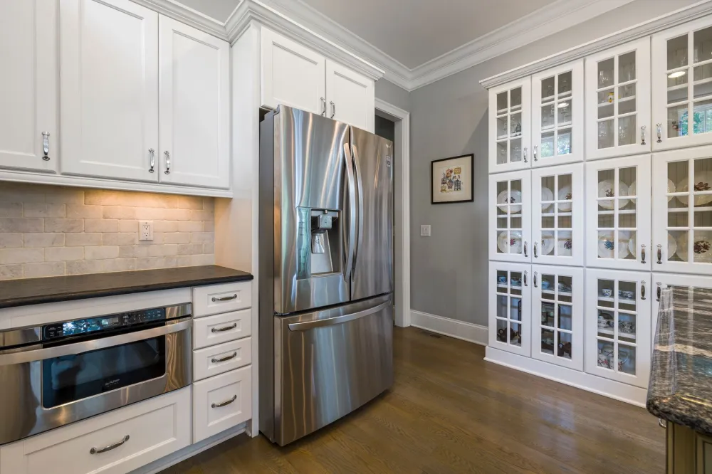 Shaker-style kitchen cabinetry installed in a Bedford TX open-concept home remodel