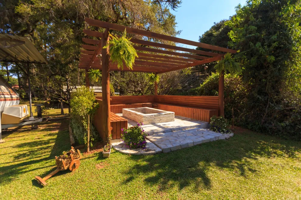 Covered pergola patio addition enhancing a backyard entertaining area in Texas