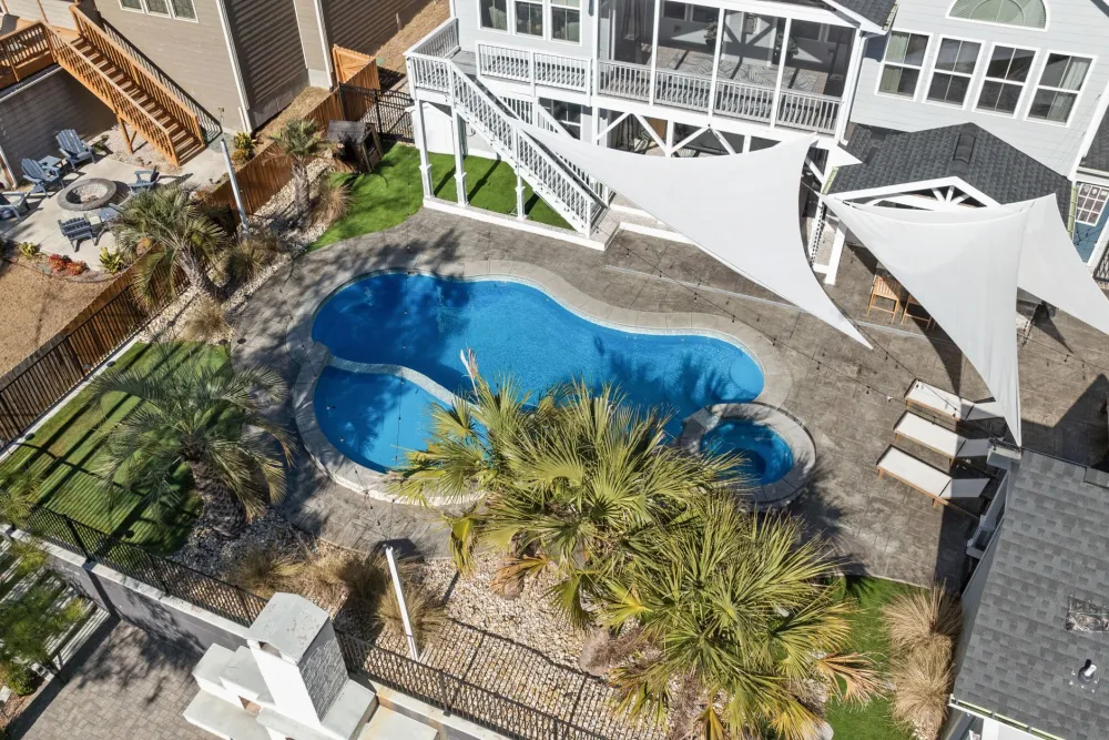 Stamped concrete patio surface in a residential outdoor living remodel