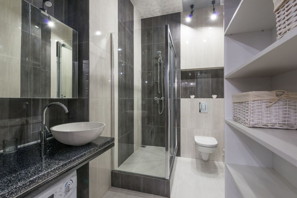 Large format porcelain tiles installed on shower walls for a clean modern look