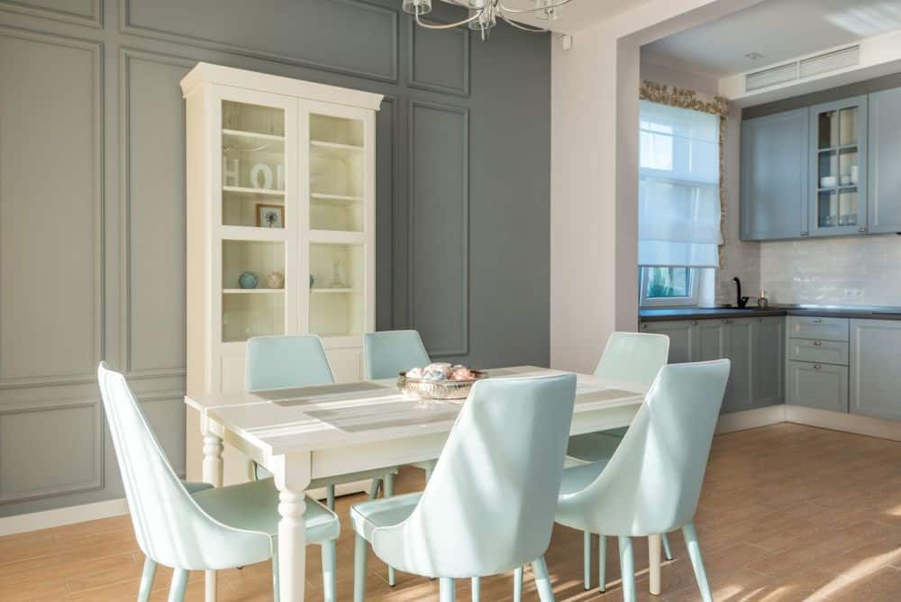 Two-tone kitchen cabinets with navy lower and white upper panels in a renovated kitchen