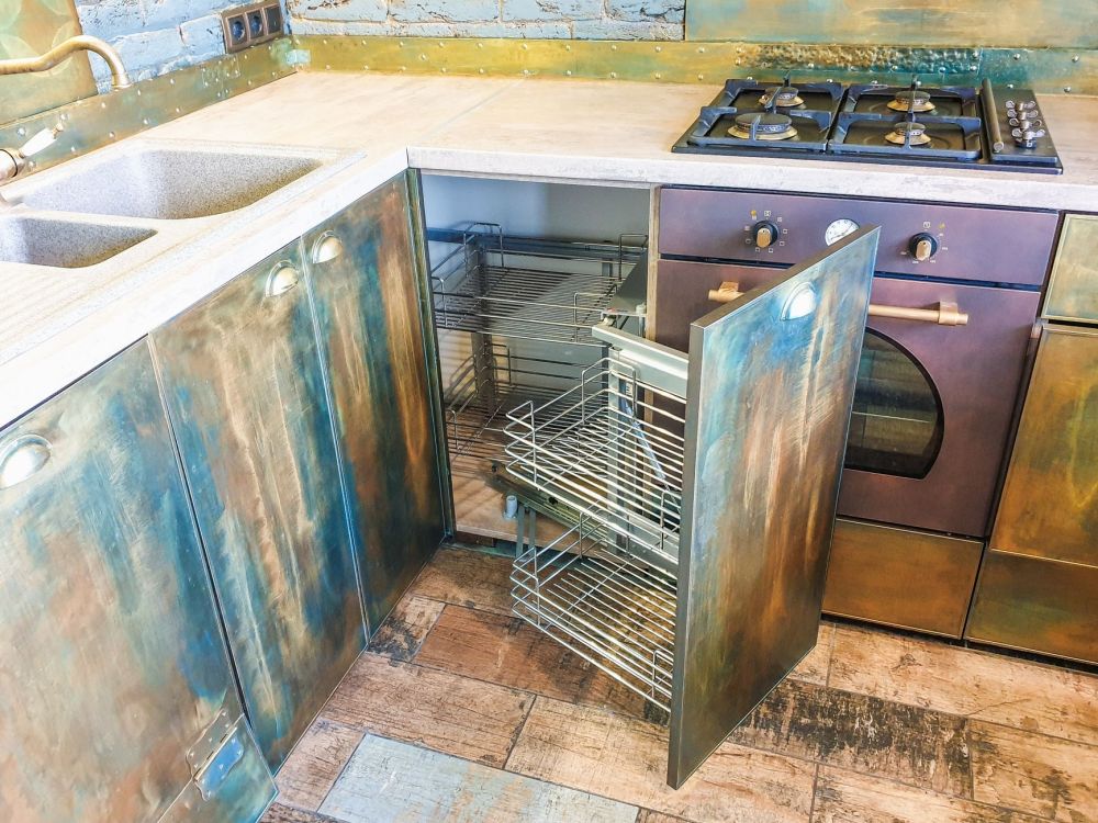Contractor removing old kitchen cabinets during a Bedford TX kitchen remodel