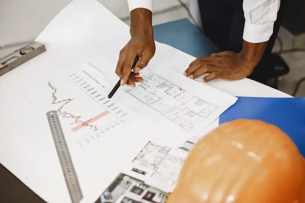 Open-plan office space under commercial finish-out construction with framed walls
