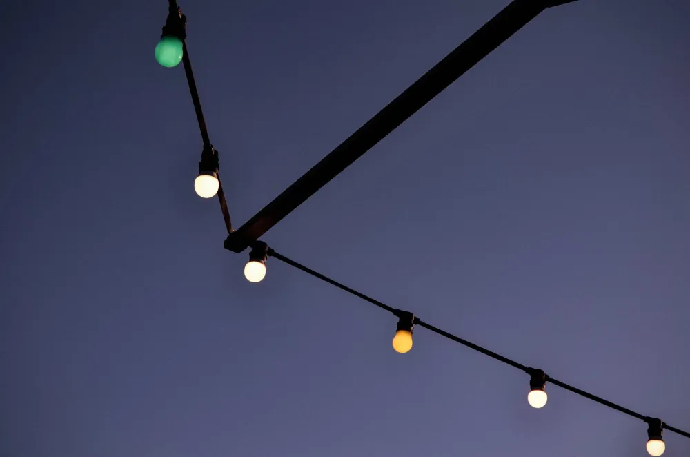 Finished covered patio at dusk with string lights perfect for Arlington TX outdoor living