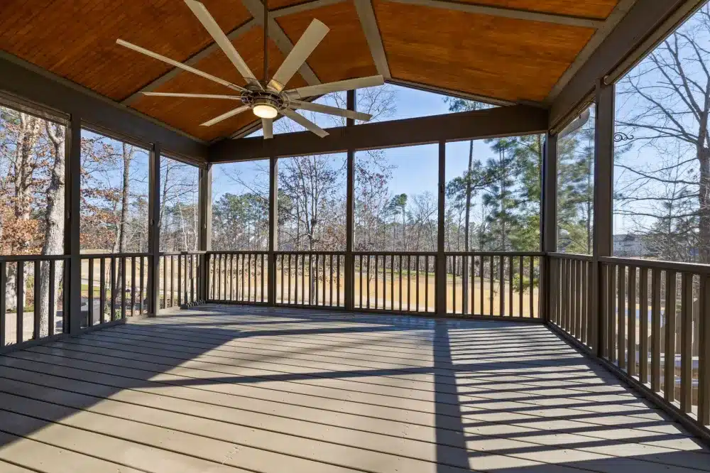 Finished deck with cable railing and outdoor seating in a Dallas Fort Worth home