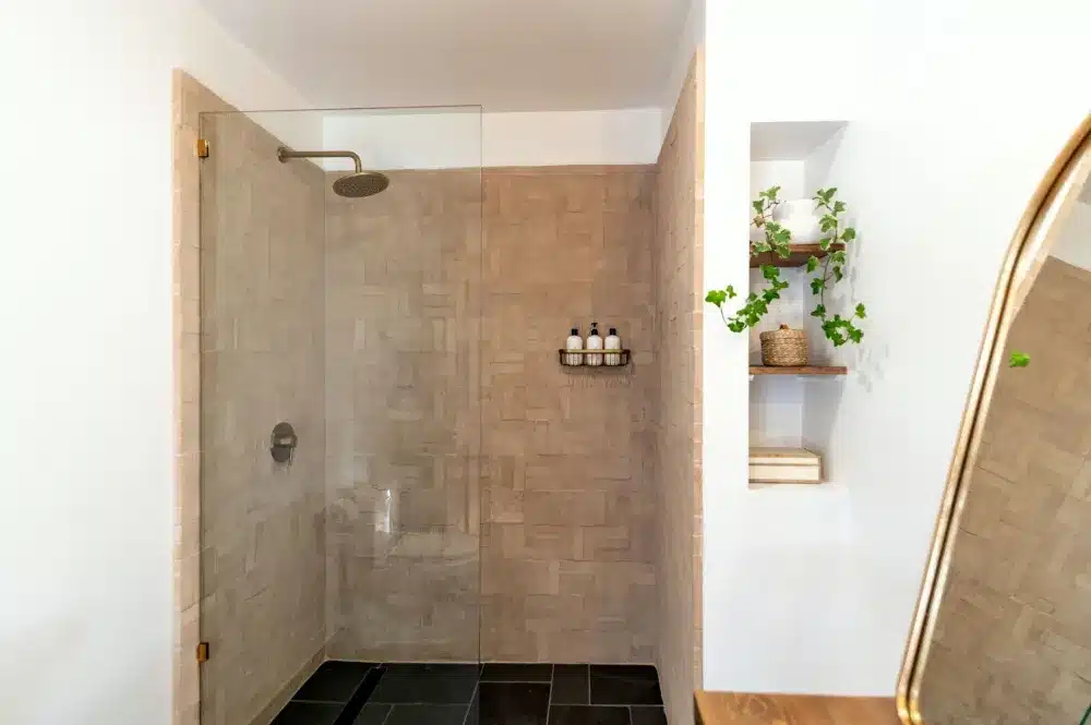 Large-format tile shower walls during a bathroom remodel in Hurst Texas