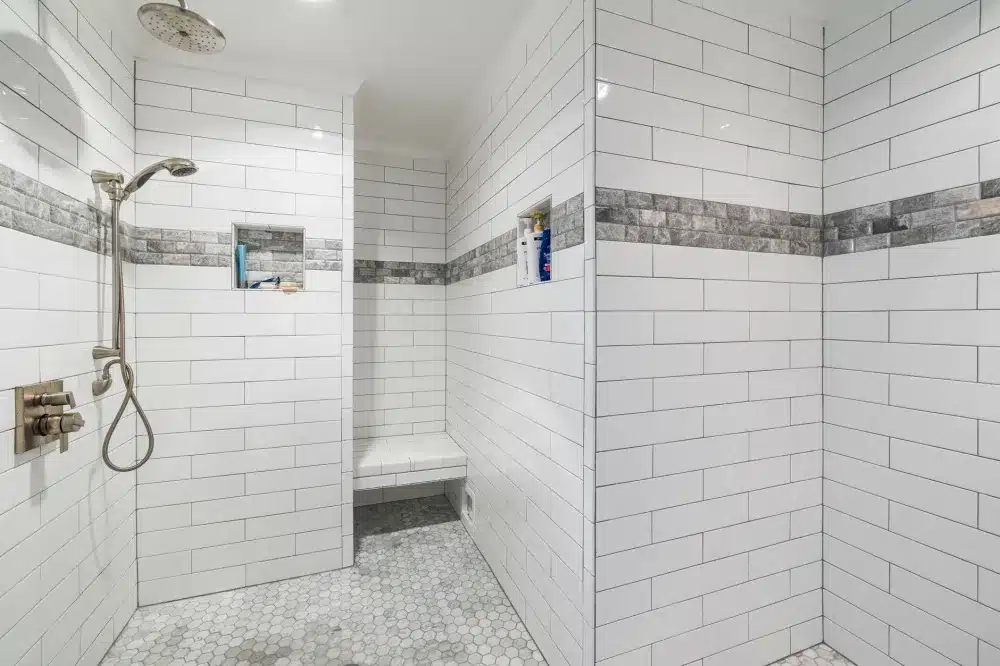 Waterproof membrane applied to shower walls before tile installation in a Texas home