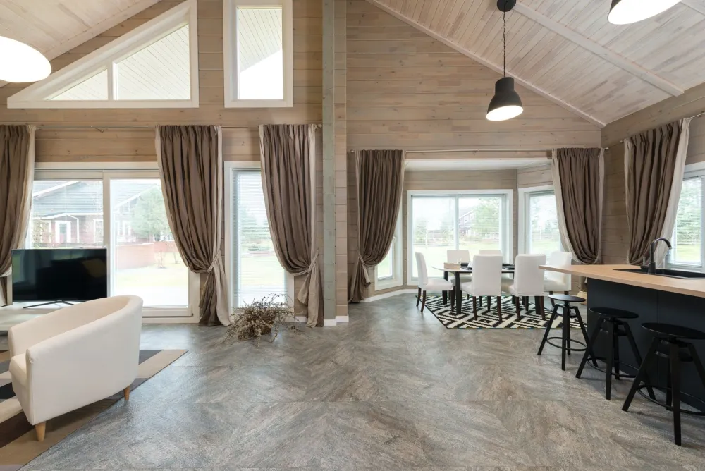 Contractor installing luxury vinyl plank flooring during a home improvement project