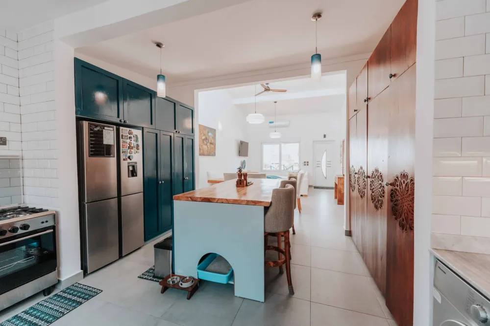 Kitchen island in an open floor plan remodel connecting dining and living areas