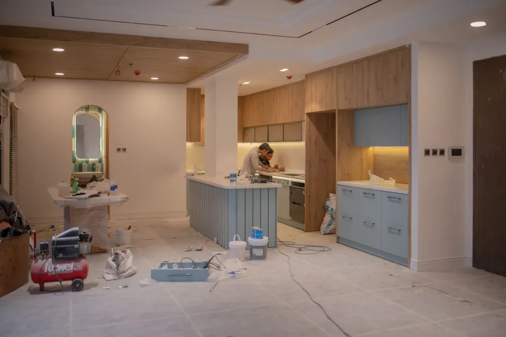 Contractor installing custom kitchen cabinets during a home remodeling project in Arlington Texas