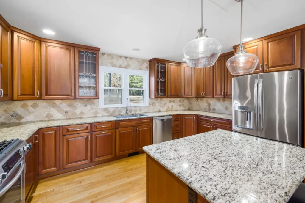 Bright open-concept kitchen remodel with white cabinets and quartz countertops in Arlington TX home
