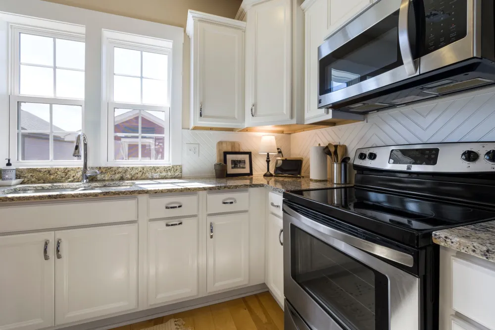 Freshly painted kitchen cabinets as a budget-friendly remodeling upgrade in Arlington