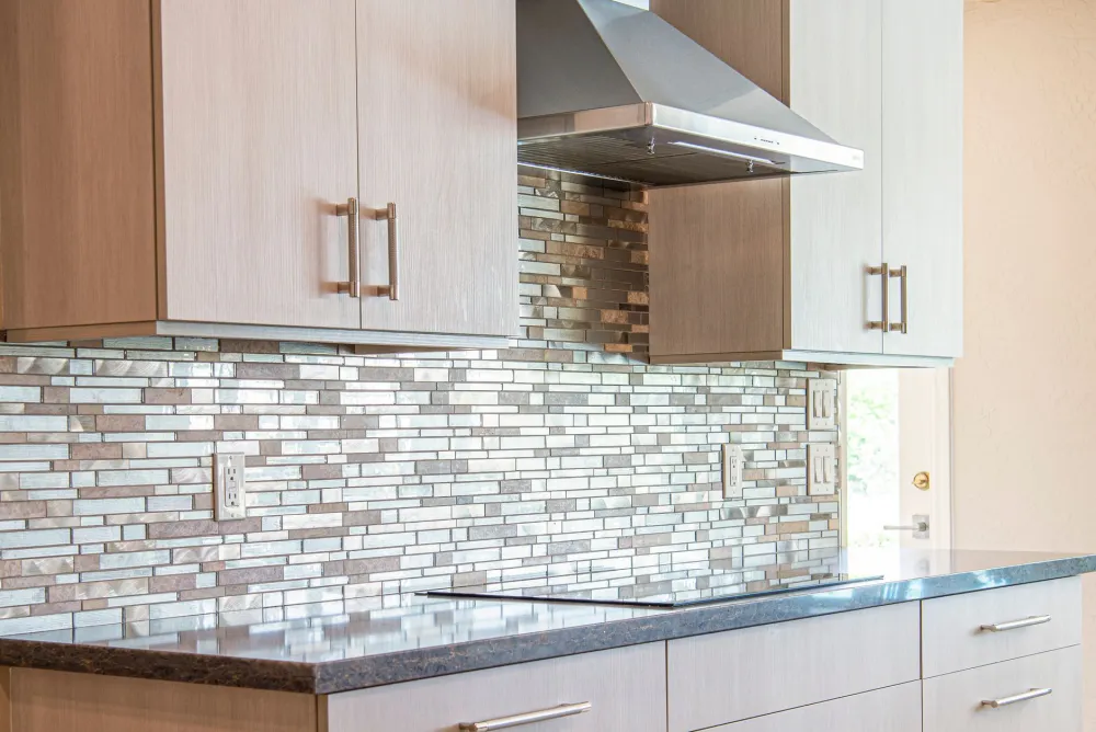Tile backsplash installation completing a kitchen remodel in a Mid-Cities Texas home