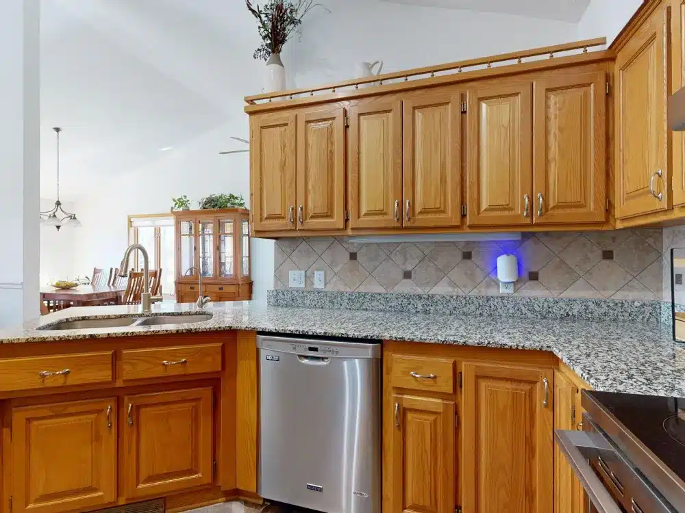 Completed kitchen renovation with new countertops, cabinets, and lighting in a Mid-Cities Texas home