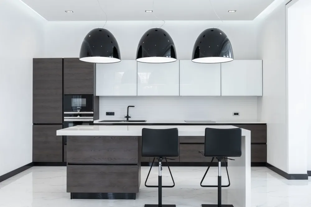 Kitchen island with pendant lighting and storage in a DFW area home remodel