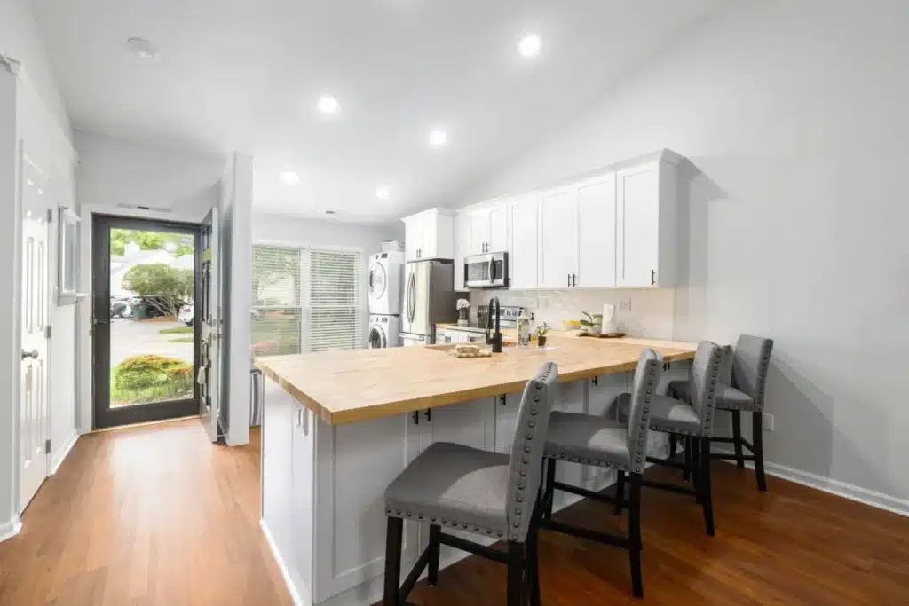 Bright modern kitchen remodel with quartz countertops and shaker cabinets in Arlington TX home