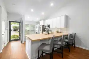 Bright modern kitchen remodel with quartz countertops and shaker cabinets in Arlington TX home