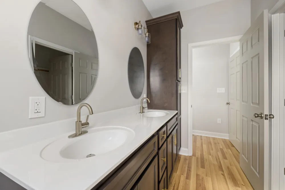 New double vanity with quartz countertops in a renovated Hurst Texas master bathroom