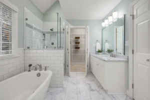 Finished master bathroom remodel in Hurst TX with double vanity and walk-in shower