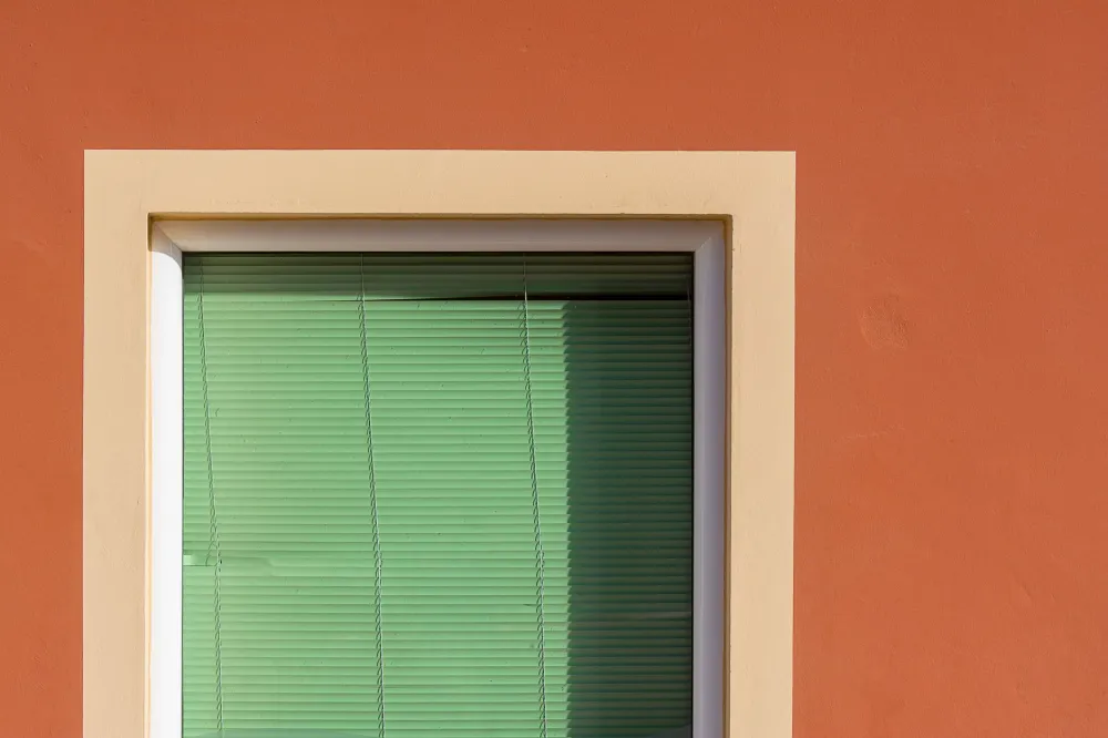 Vinyl and fiberglass replacement window frames displayed for homeowner selection