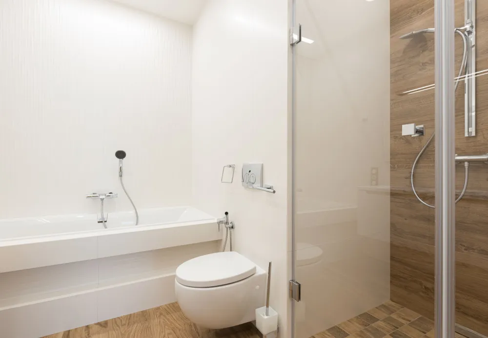 Acrylic wall panels installed in a walk-in shower as a grout-free tile alternative