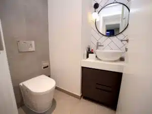 Small bathroom remodel in Bedford TX with modern tile vanity and walk-in shower