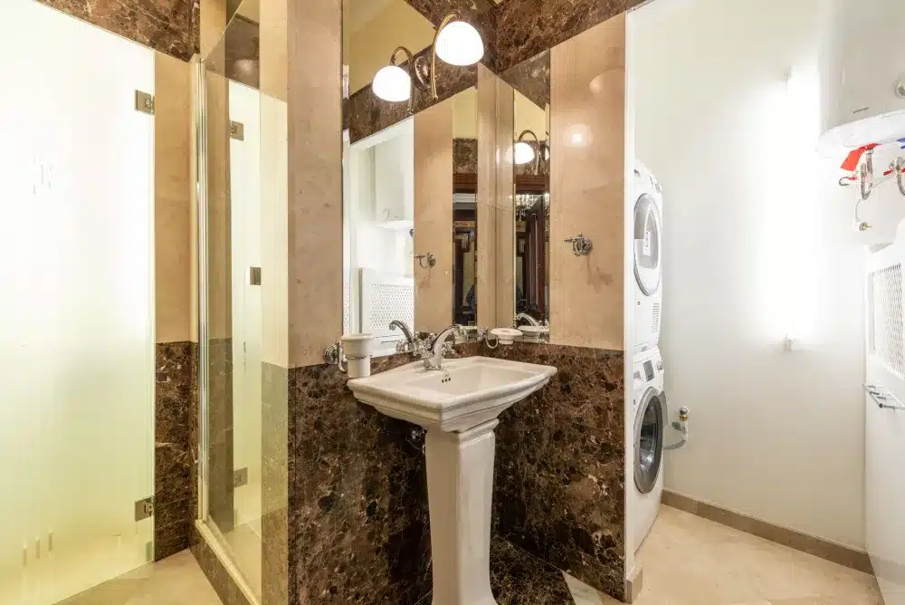 Finished small bathroom remodel with floating vanity and large-format floor tile in Bedford TX