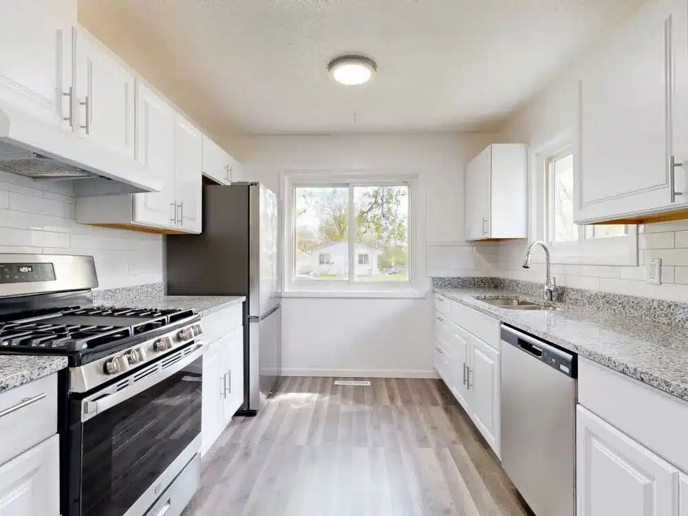 Neutral quartz countertop kitchen renovation showing timeless home improvement design choices