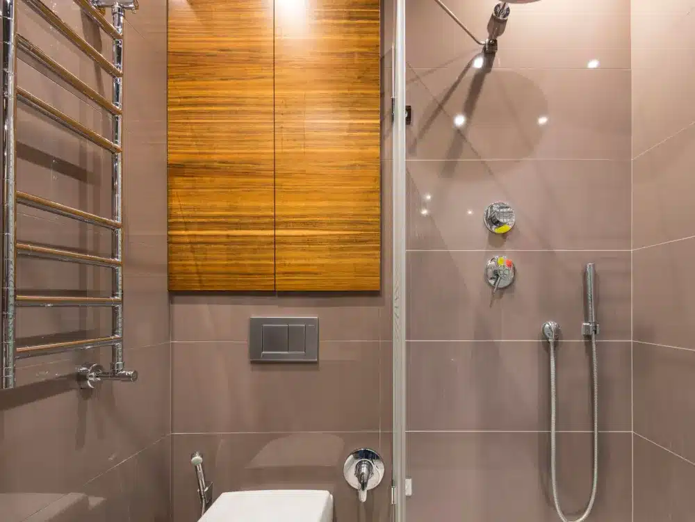 Waterproofing membrane applied to shower walls before tile installation during bathroom remodel
